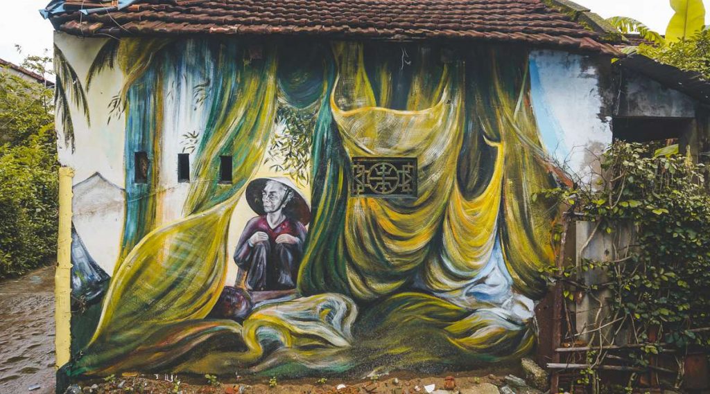muurschildering dorp Tam Hai